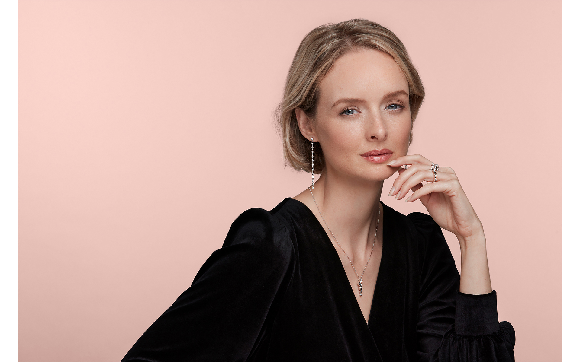 advertising jewellery photo shoot for winsor bishop & Prestons Norwich with model in  photo studio norwich pink backdrop