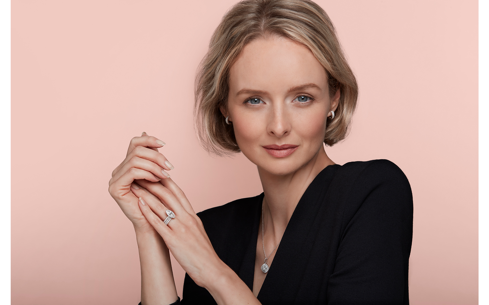 advertising jewellery photo shoot for winsor bishop & Prestons Norwich with model in  photo studio norwich pink backdrop