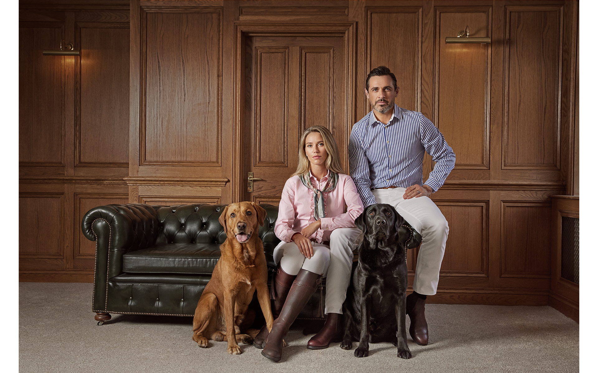 advertising fashion photo shoot for Paul brown clothing male and female models with 2 dogs at egerton house newmarket suffolk