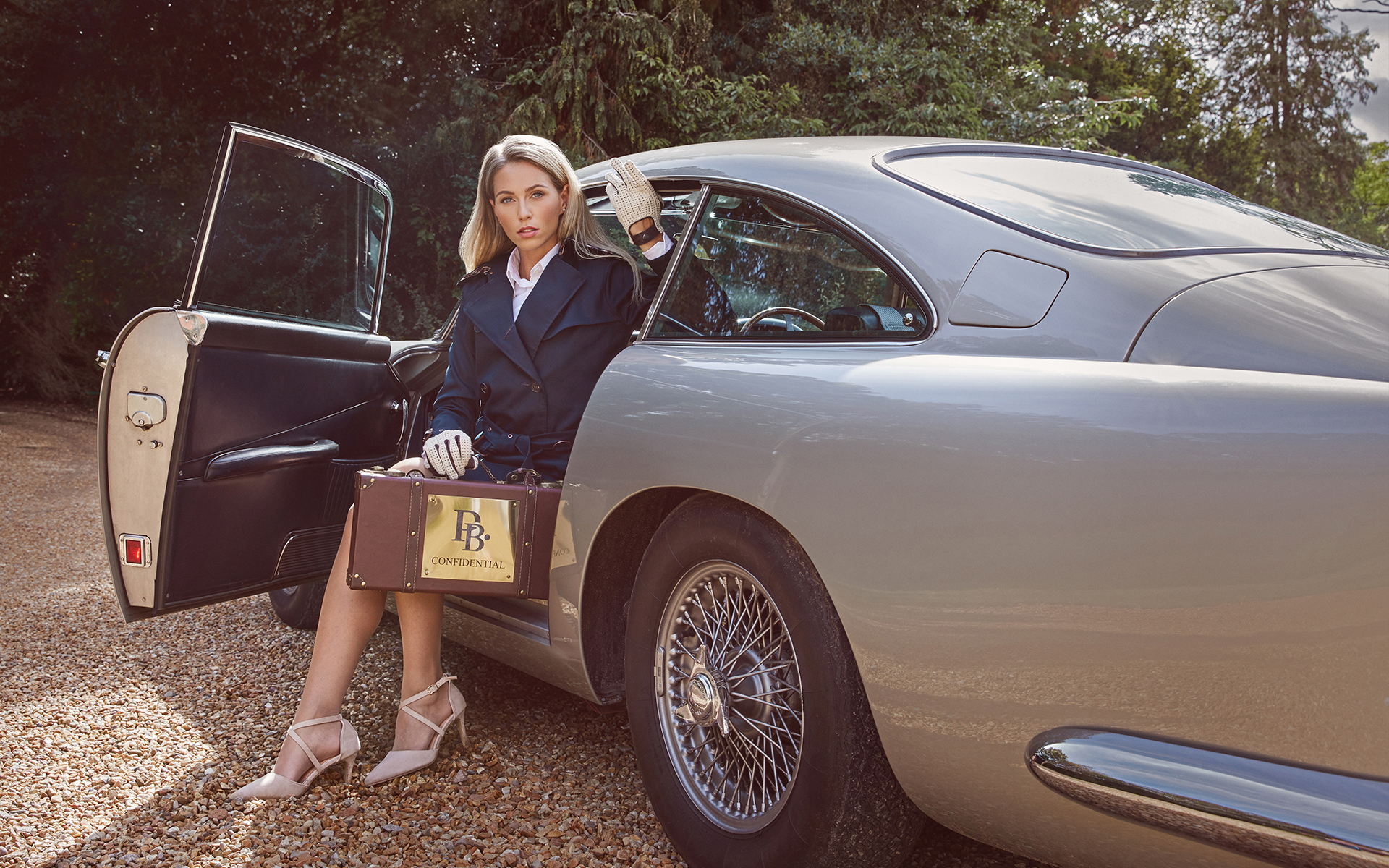 Ballerina dancing in a photography studio for a photo shoot in front of a canvas backdrop